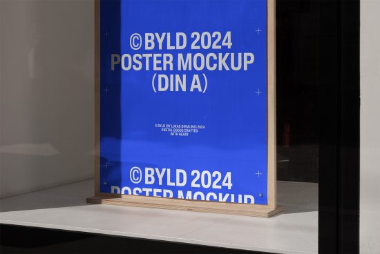 BYLD 2024 Poster Mockup DIN A displayed on a wooden stand white background perfect for showcasing poster designs for designers keywords include mockup template