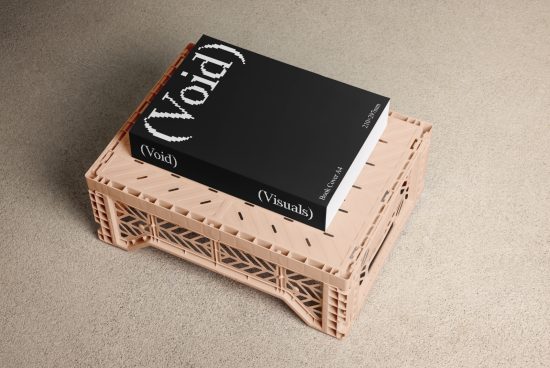 Mockup of a black A4 book cover with the title Void placed on a beige plastic crate against a textured surface. Ideal for showcasing book cover designs.