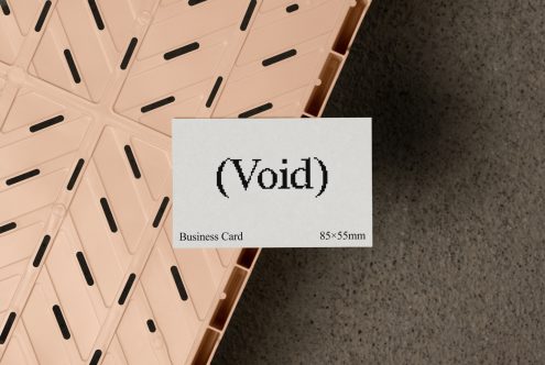 Business card mockup on a textured background with Void text. Ideal for designers. Perfect for showcasing logo, typography, branding. 85x55mm card dimensions.