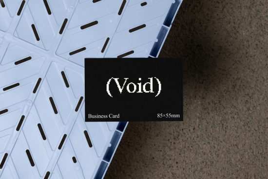 Business card mockup showcasing black card with Void text on textured surface background. Ideal for designers, templates, and graphic design projects.