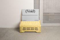 C6 envelope mockup in white with pixelated logo on yellow shipping crate