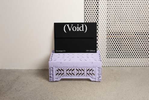 Black envelope with Void text mockup. Set against minimalist background with purple crate. Ideal digital asset for graphic designers. Template category.