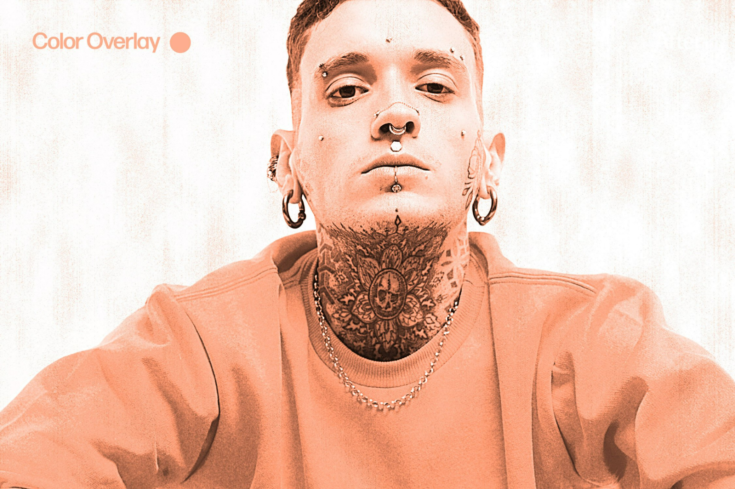 Bold tattooed individual with piercings in orange color overlay. Ideal graphic for edgy templates, creative mockups, and modern design projects.