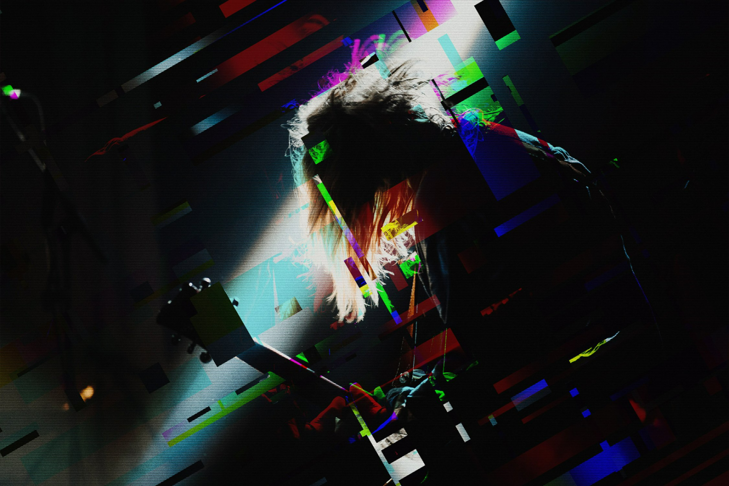 Digital abstract graphic with vibrant glitch effects overlaying a silhouette of a guitarist under stage lights. Perfect for design templates and creative mockups.