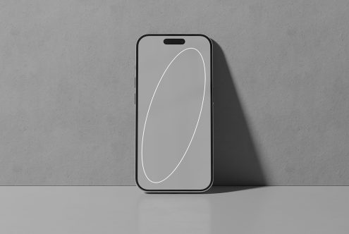 iPhone mockup standing on a gray surface against a gray background digital asset for designers modern smartphone template for showcasing app designs