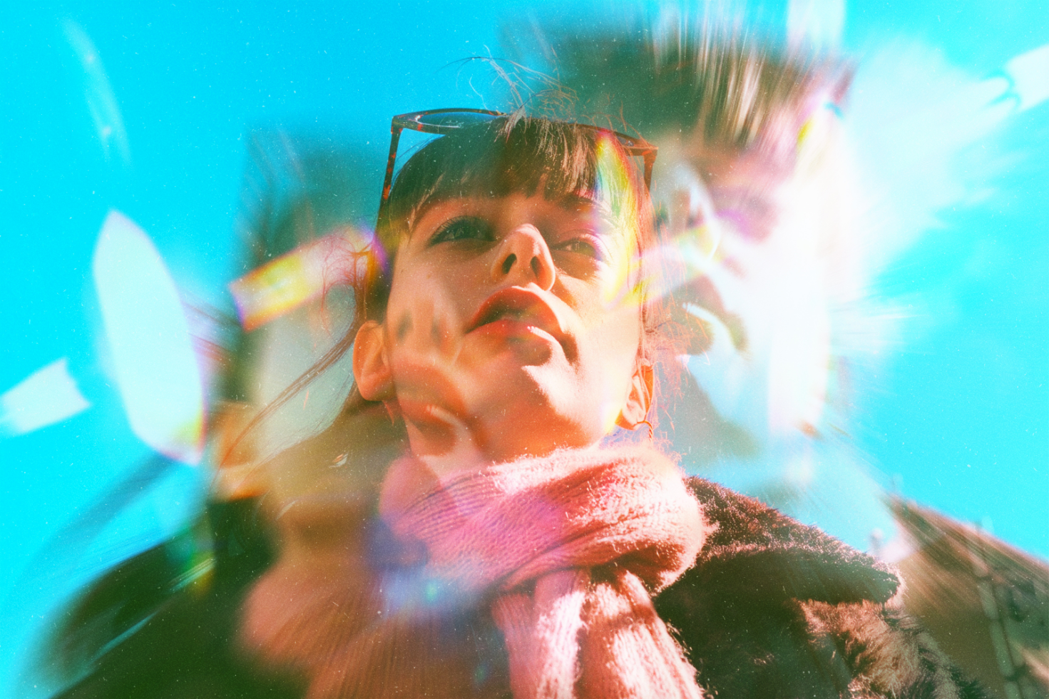 Surreal double-exposure photo with vibrant colors featuring a woman in sunglasses and a scarf; ideal for graphic design projects, artistic templates, and creative mockups