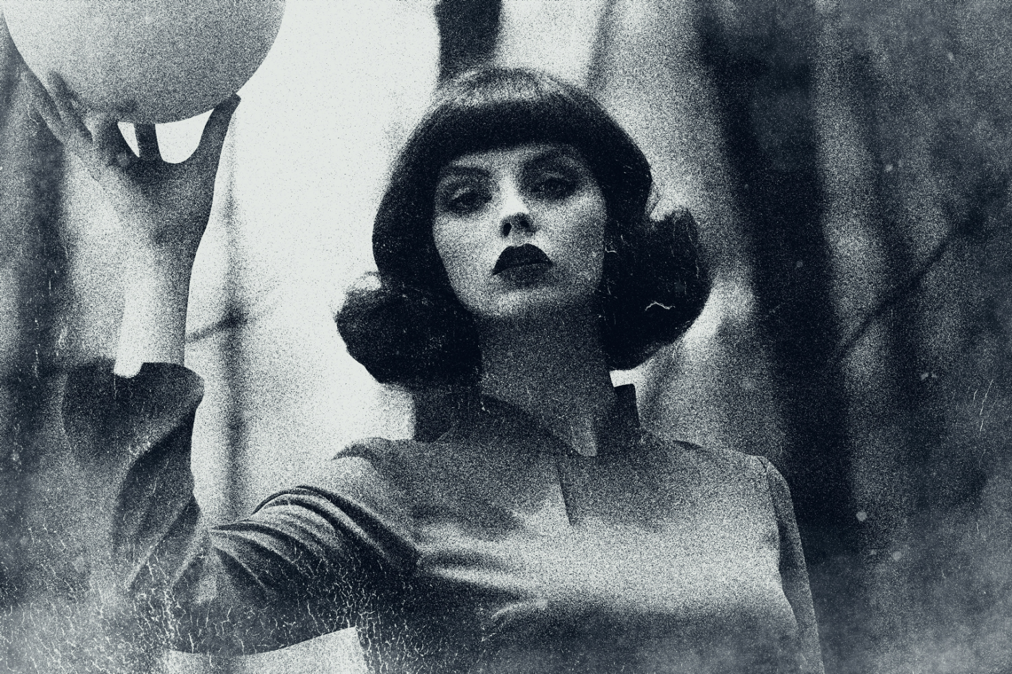 Vintage black and white photo of a woman holding a ball. Perfect for graphic design, mockups, digital artwork, and retro-themed design templates.