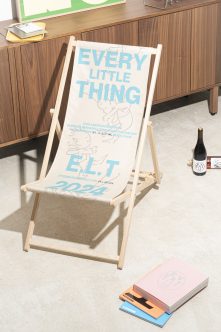 White beach chair mockup with blue Every Little Thing typography printed on fabric