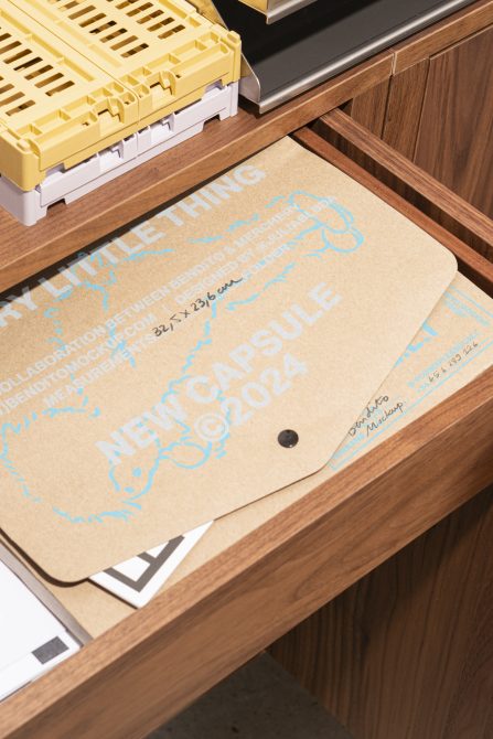 Wooden drawer with printed envelopes for NEW CAPSULE 2024 collaboration mockup. Suitable for designers seeking creative templates and graphics for projects.