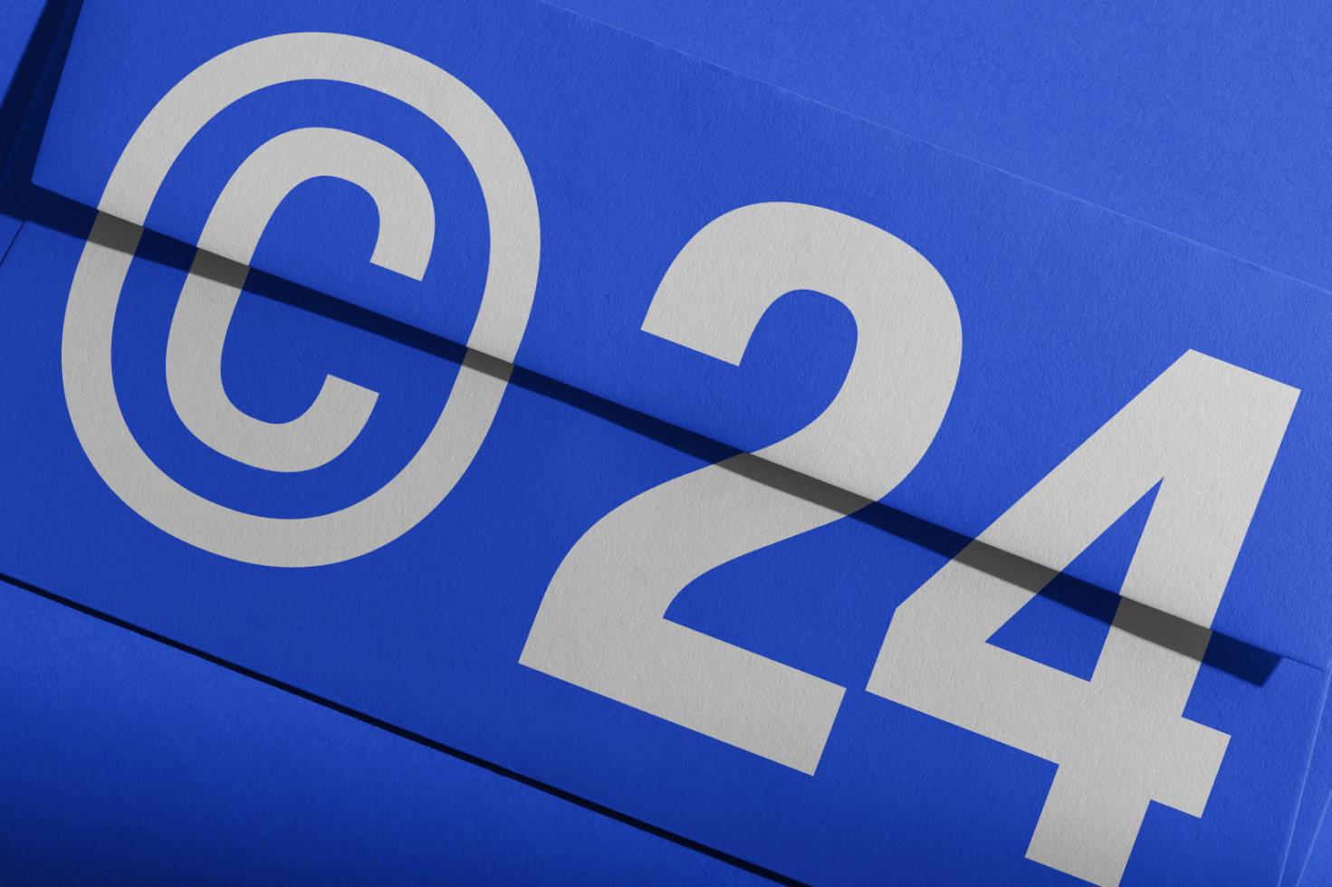 Bright blue poster design showcasing the number 24 and copyright symbol, ideal for digital assets, mockups, templates, and graphic design resources.