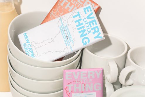 Stacked white bowls and cups filled with colorfully packaged chocolate bars every little thing ideal for showcasing product mockups for digital design assets