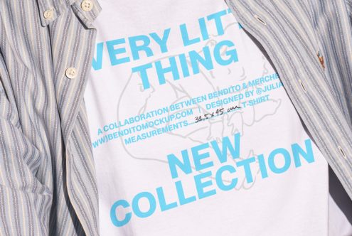 Close-up of a white t-shirt mockup with blue typography reading Very Lit Thing New Collection worn under a striped shirt ideal for designers digital assets