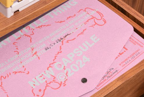 Pink design folder with text reading collaboration between Bendito, Mercherly. New Capsule 2024. Held in a wooden drawer, creative mockup for designers.