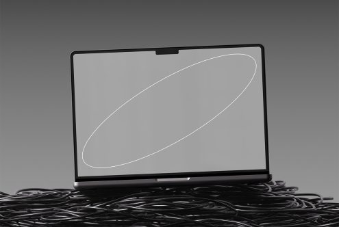 Laptop mockup with blank screen, placed on tangled cables, minimalist design. Perfect for showcasing website designs, app interfaces, or creative presentations.