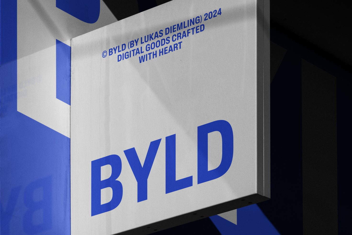 Signboard mockup with bold blue text saying BYLD, ideal for logo or branding presentations for digital designers wanting a professional and contemporary look