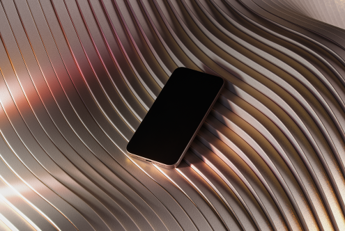 Smartphone mockup on abstract wavy metallic background suitable for designers. High-resolution asset for visuals, advertising, graphic design, and presentations.