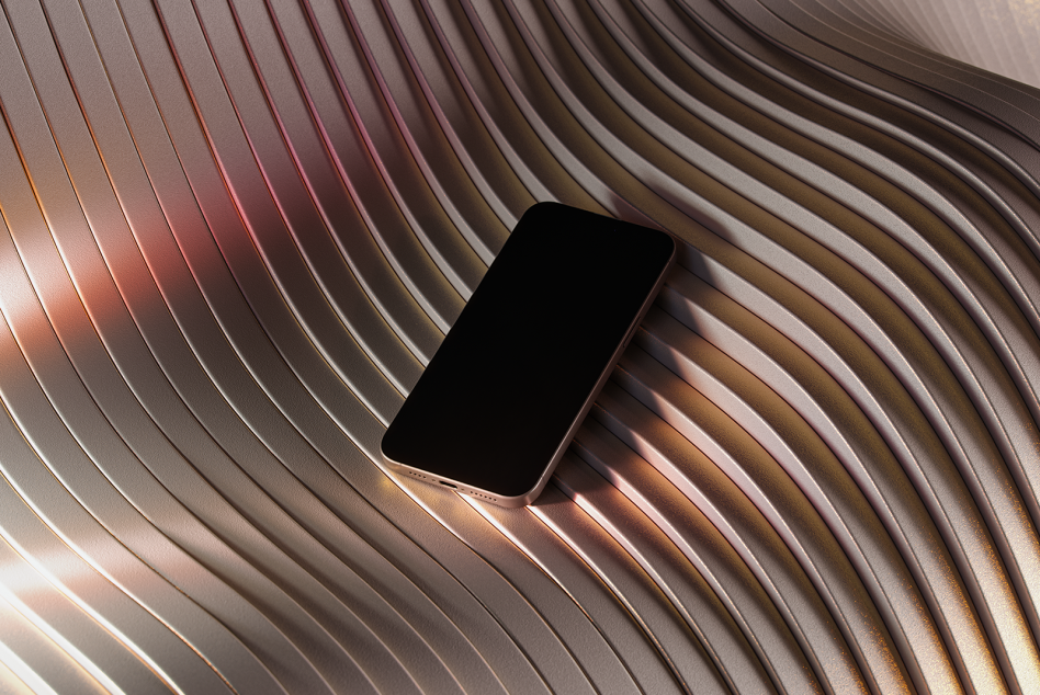 Phone on striped wavy background with black screen catching warm light