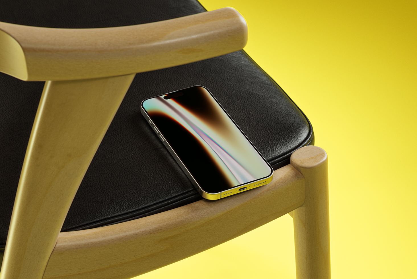 Smartphone mockup on a black leather cushion with wooden chair against yellow background. Perfect for graphic designers showcasing their app designs.