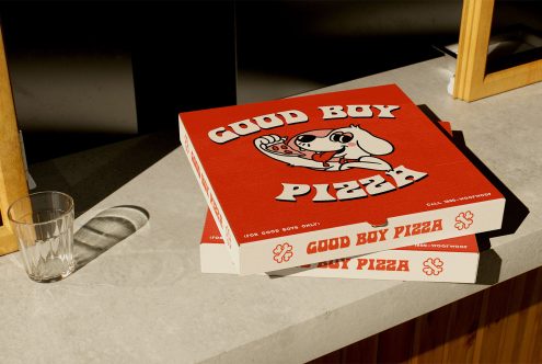 Pizza box mockup display on a kitchen counter with Good Boy Pizza branding perfect for showcasing graphics templates for designers selling packaging designs