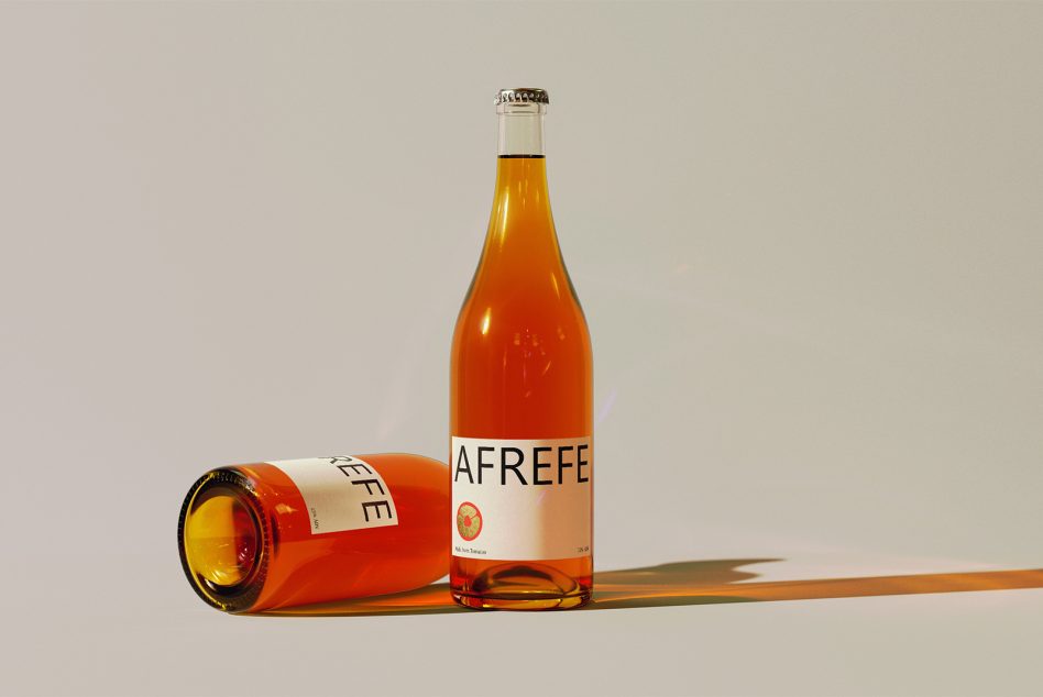 Afrefe beer bottle mockup with one upright, one laying down on neutral background