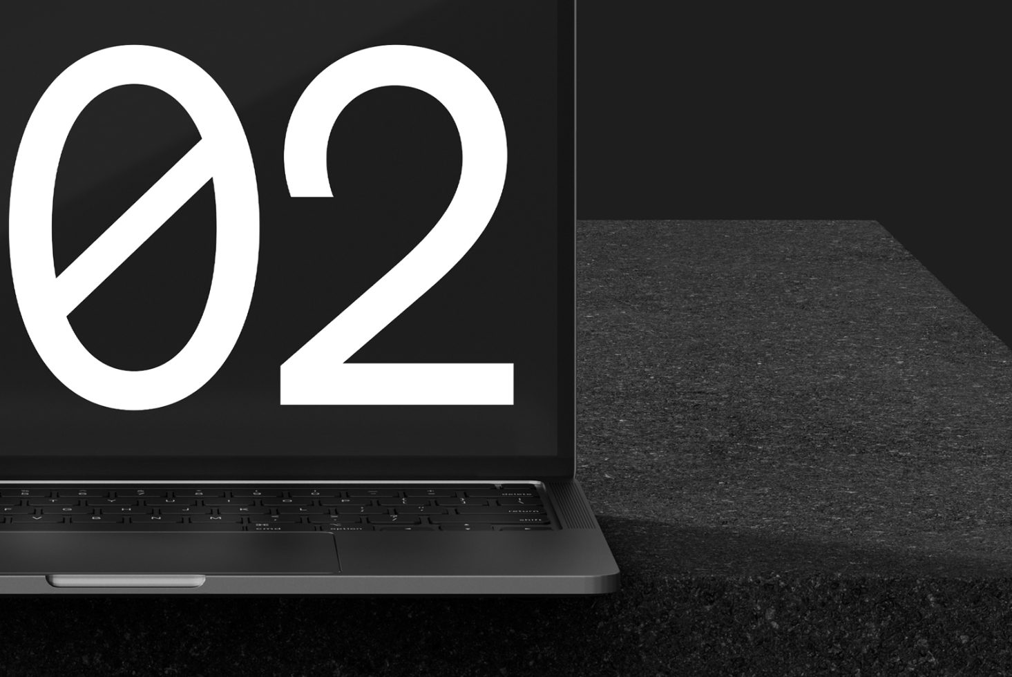 Black and white laptop mockup with large modern font display on a textured surface ideal for designers seeking sleek templates and graphics for digital projects.