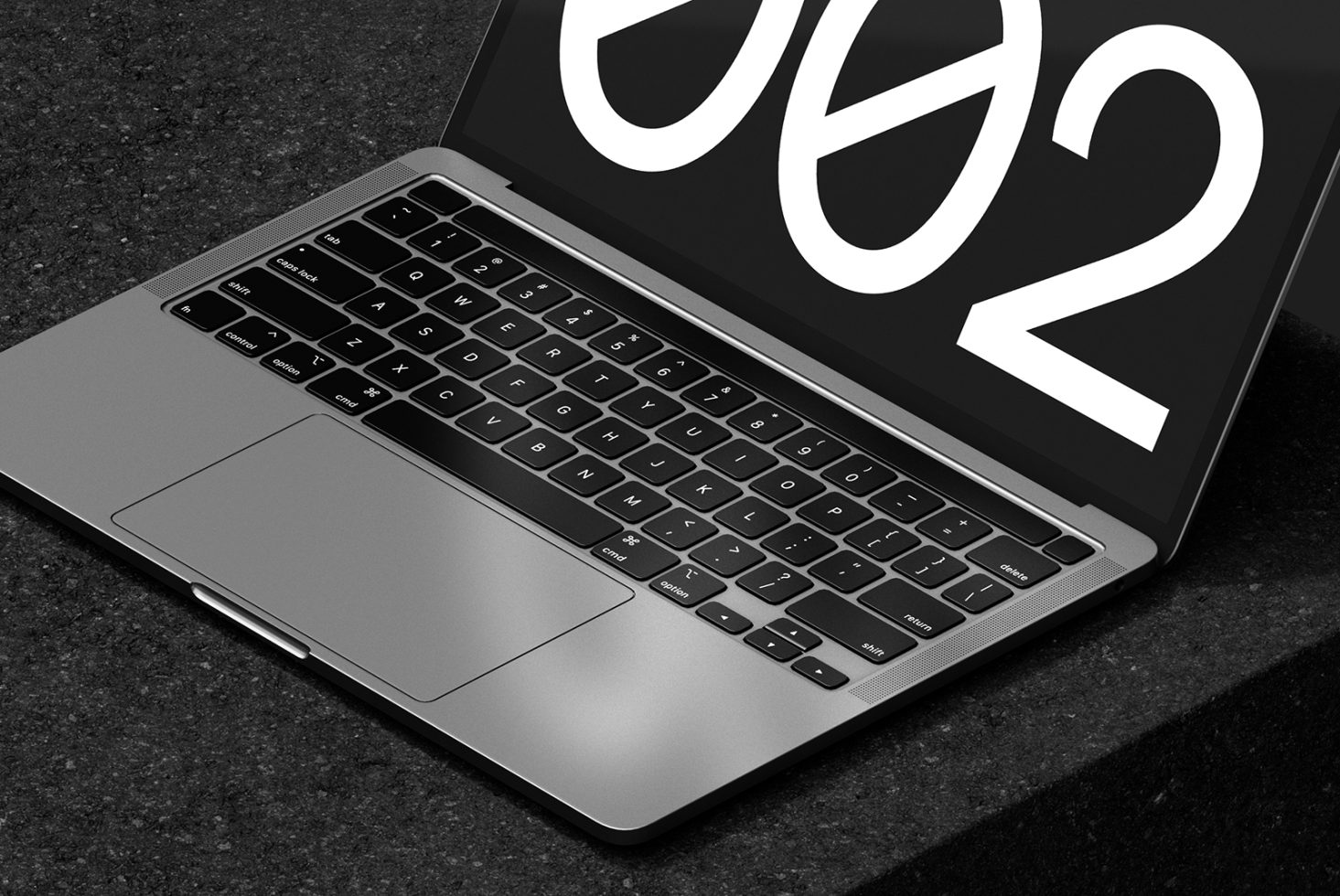 Laptop mockup displaying large numbers on screen with sleek keyboard design. Ideal digital asset for designers in need of modern tech visuals or templates.