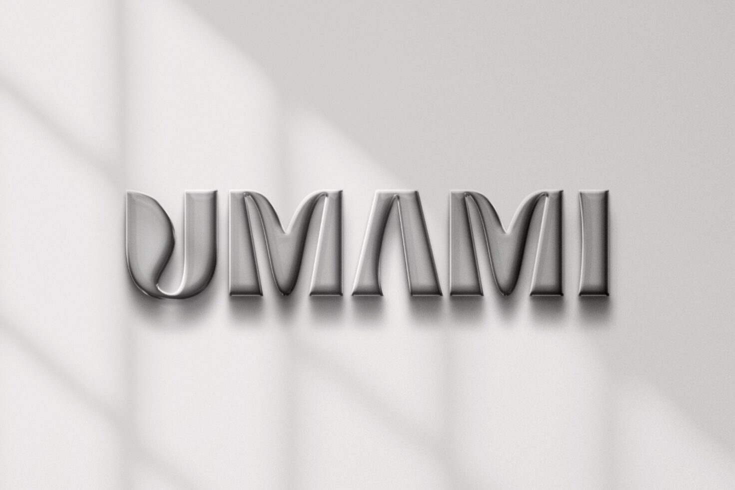 3D text mockup reading UMAMI in metallic finish against a soft shadowed background ideal for graphic design branding and typography projects.