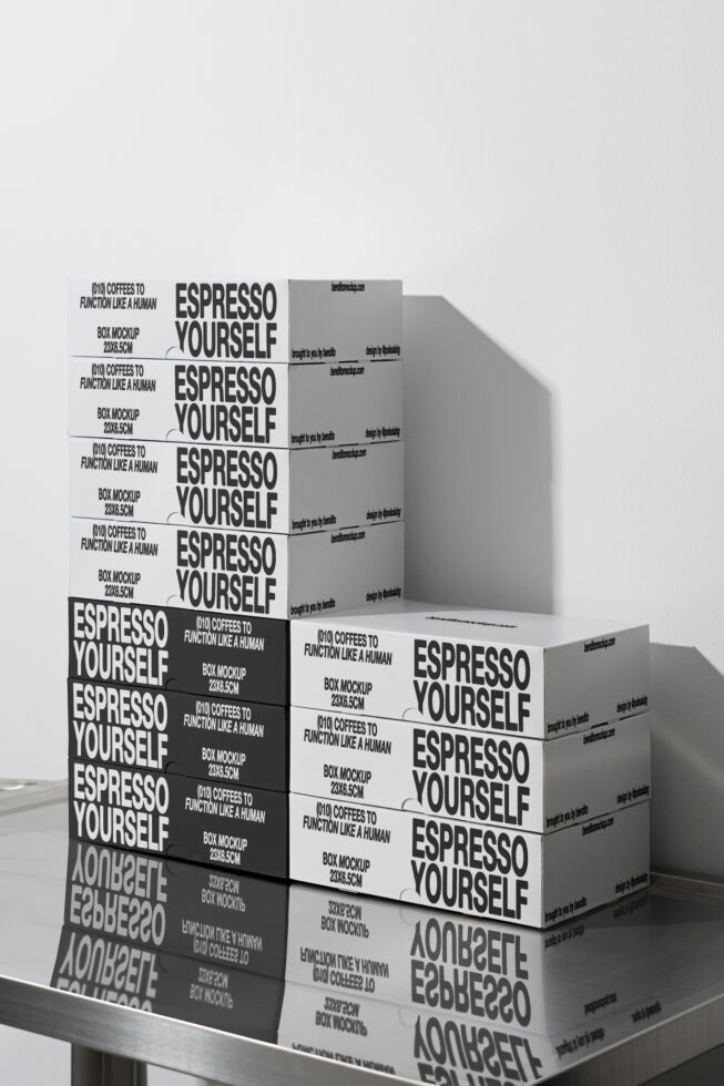 Box packaging mockup labeled Espresso Yourself stacked on a reflective surface. Ideal for designers seeking modern, typography-focused graphics for branding.