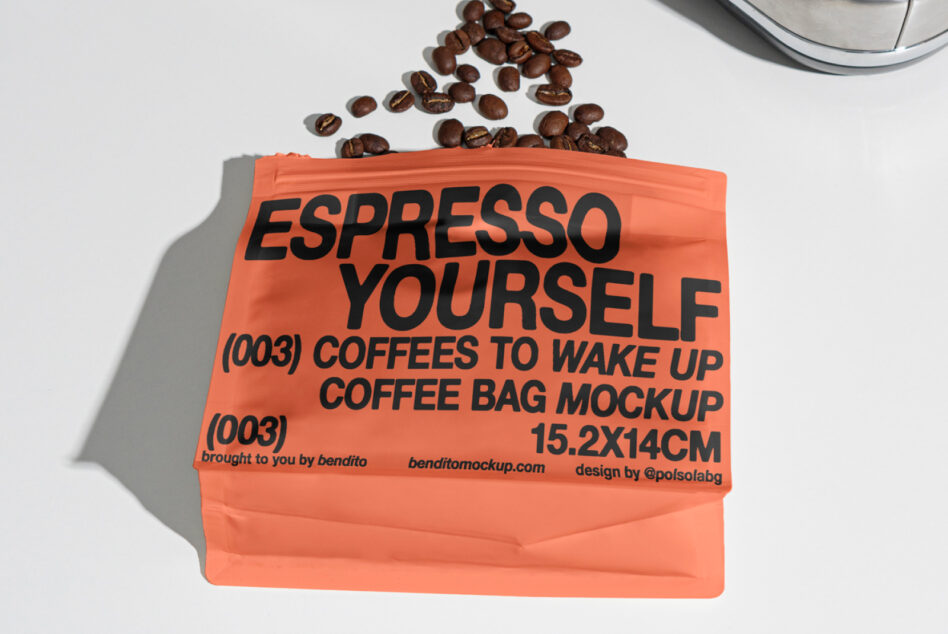 Coffee bag mockup with bold text Espresso Yourself; orange packaging; coffee beans scattered; design asset for designers; ideal for branding projects.