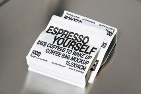 Mockup of coffee packaging with bold text Espresso Yourself on a sleek metallic surface. Perfect for designers needing modern coffee bag mockup templates.