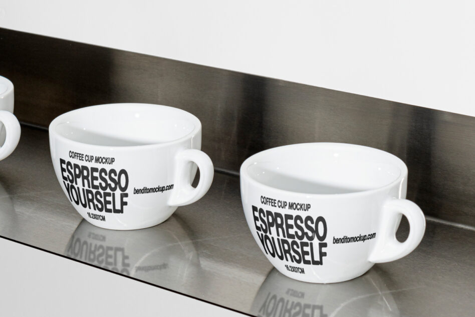 Two white espresso mugs arranged on sleek dark metal shelf setup
