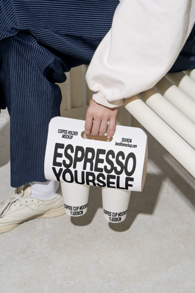 Mockup of a coffee holder with bold text Espresso Yourself. Ideal for designers seeking minimalist designs in coffee-related templates and graphics.