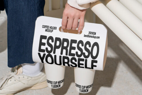 Coffee holder mockup with text Espresso Yourself held in hand ideal for designers. Features two coffee cup mockups for branding design. Template asset.