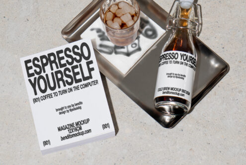 Magazine and cold brew bottle mockup on a metal tray with ice coffee. Ideal for graphic designers in mockups and branding. High-quality design asset.