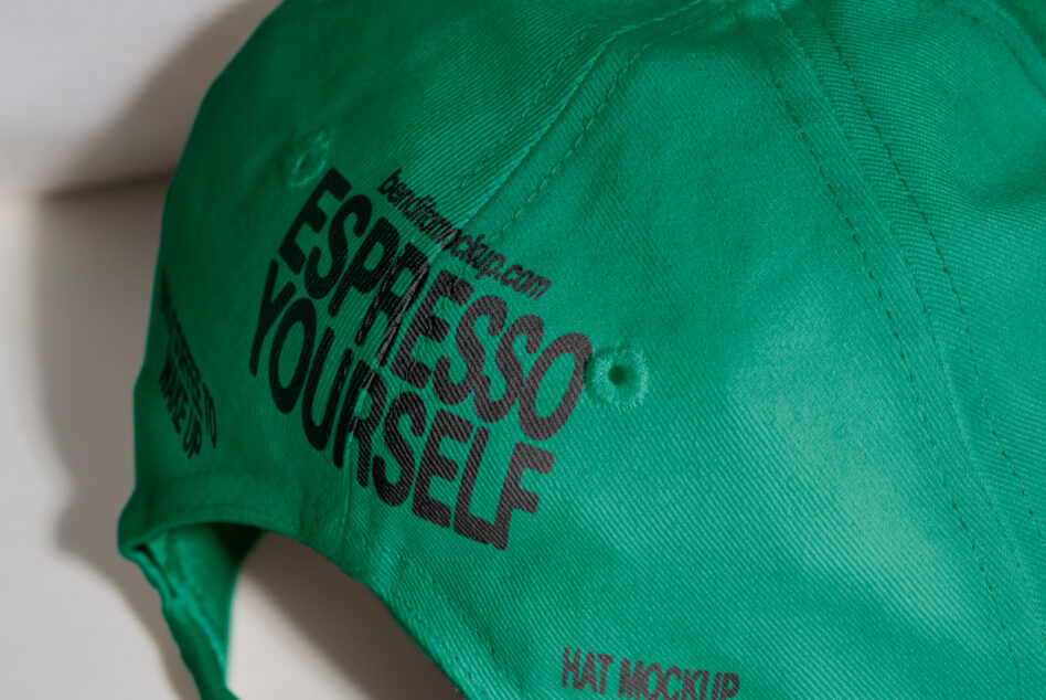 Green cap featuring bold text Espresso Yourself on the front. Perfect for mockup use in product design and branding projects. Ideal for designers.