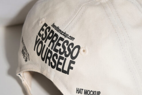 White canvas hat featuring bold black typography with Espresso Yourself text. Ideal hat mockup for designers. Keywords: mockup design template.