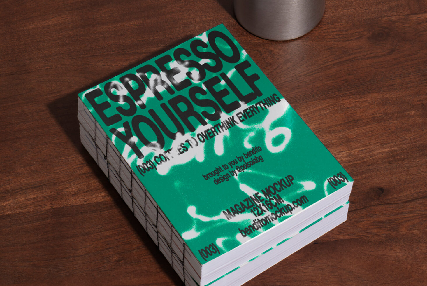 Magazine mockup on wooden table displaying cover with bold text Espresso Yourself in green color scheme ideal for graphic design and layout presentations.