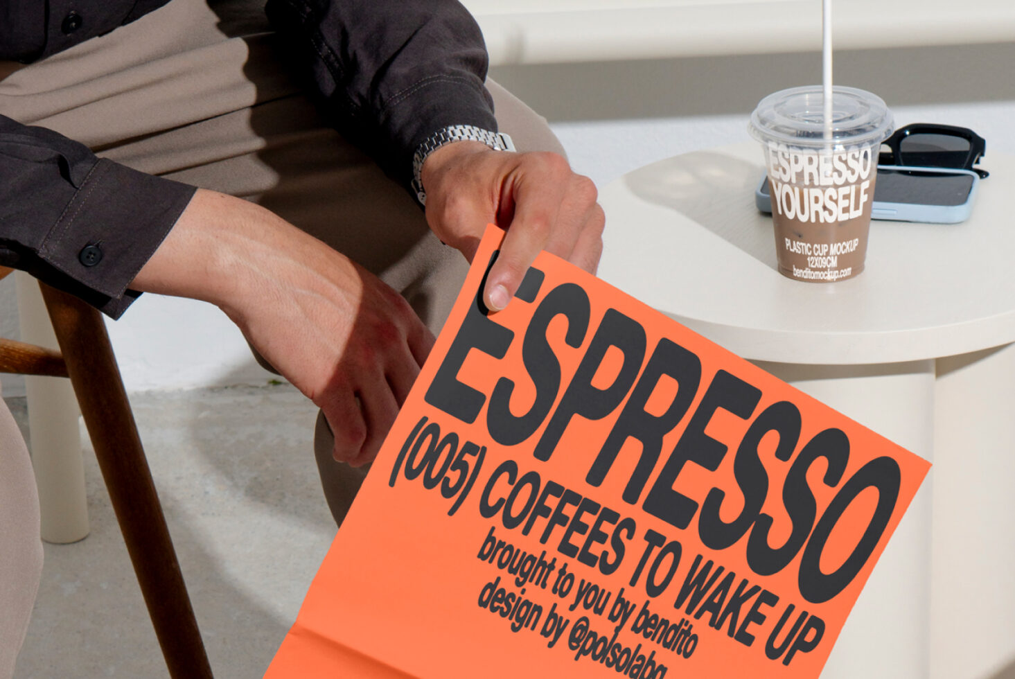 Designer mockup featuring a coffee-themed poster and cup on a table. Ideal for showcasing fonts and graphic designs for branding projects.