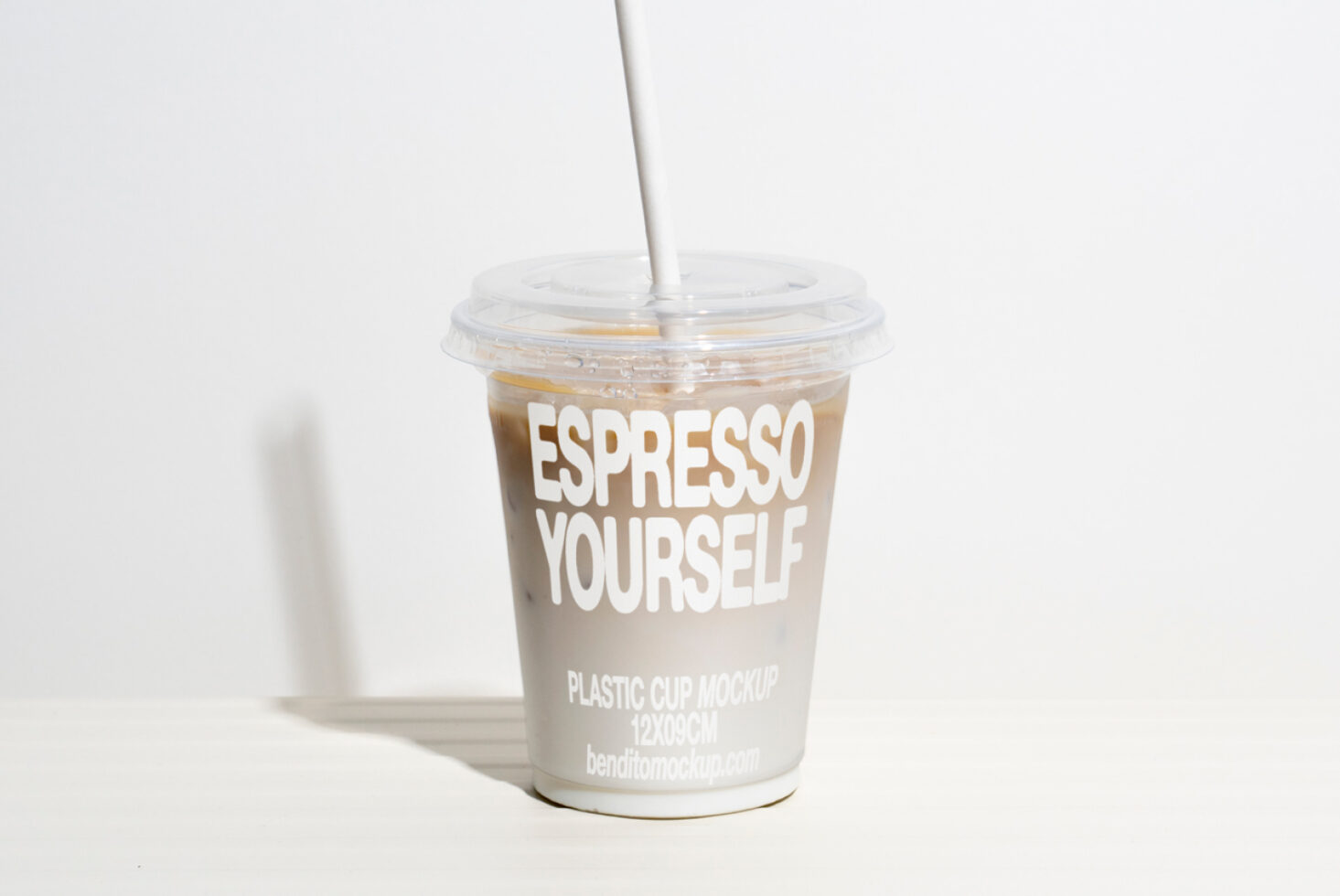 Plastic cup mockup with iced coffee and custom typography design Espresso Yourself Creative design asset for branding in Mockups category for designers