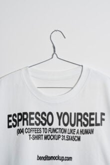 White t-shirt on hanger with Espresso Yourself graphic print mockup