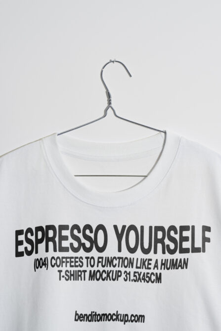 T-shirt mockup featuring bold text Espresso Yourself on a hanger. Ideal for designers seeking trendy typography templates and graphic design assets.