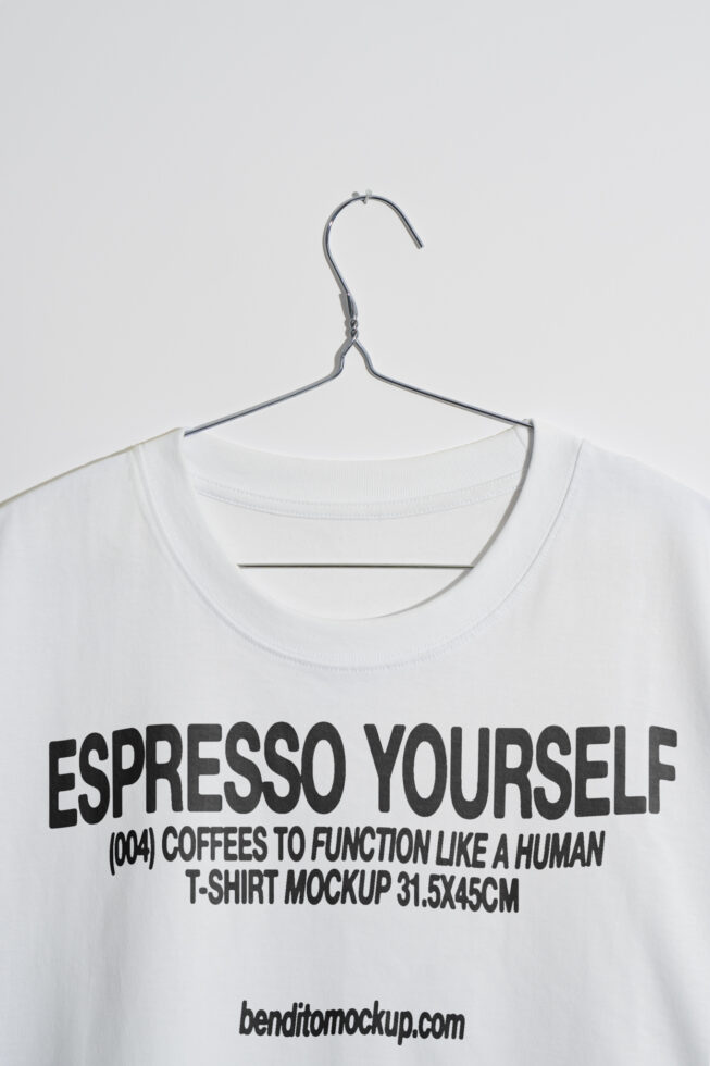 T-shirt mockup featuring bold text Espresso Yourself on a hanger. Ideal for designers seeking trendy typography templates and graphic design assets.