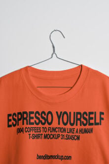 Orange t-shirt on hanger with Espresso Yourself graphic print mockup