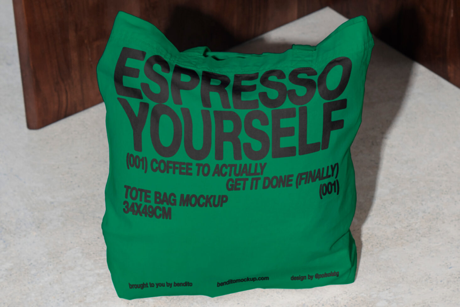 Green tote bag mockup on floor with ESPRESSO YOURSELF text ideal for designers graphic asset stylish typography design coffee-themed branding