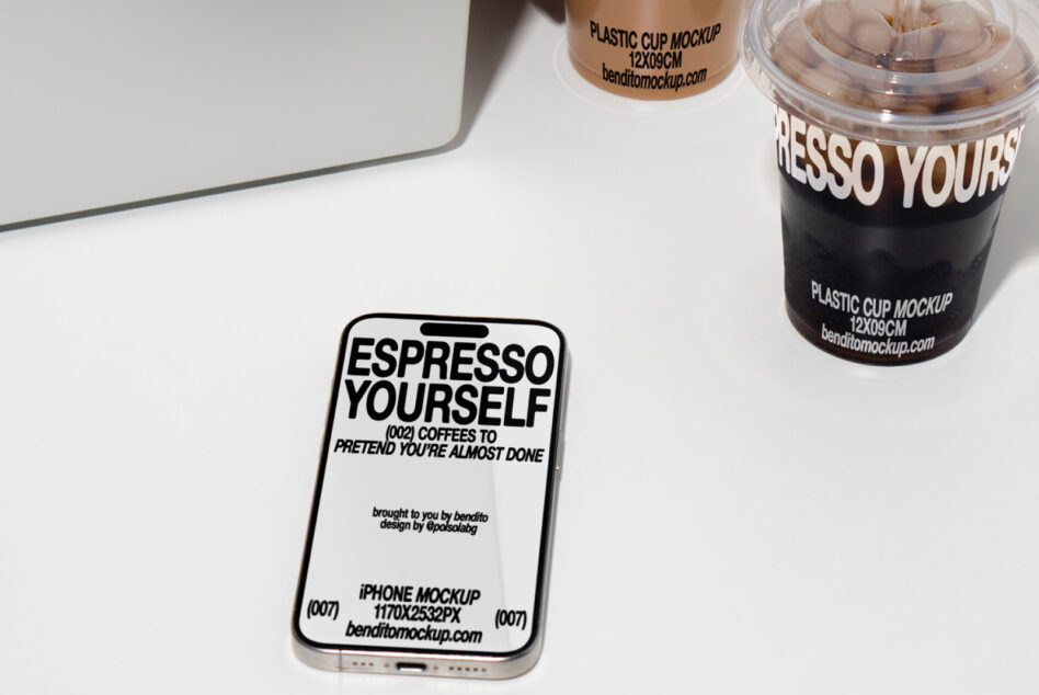 Clean desk mockup with phone display, coffee cup, laptop showing lifestyle branding