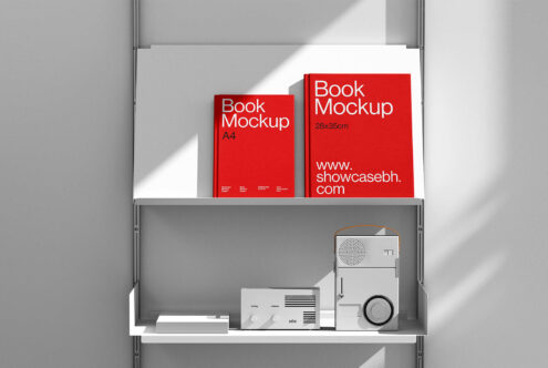 Red book mockups on a white shelf with vintage radios. Minimalist design suitable for showcasing book covers. Ideal for designers seeking clean templates.