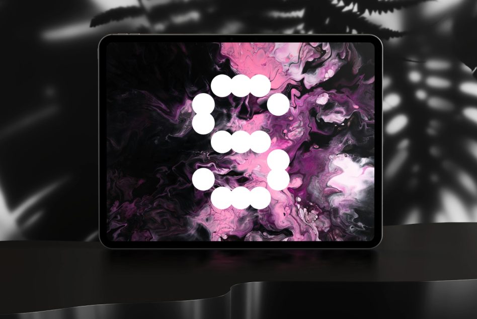 Digital tablet with abstract liquid paint design in pink and black shades, displaying a modern minimalist numeral 5. Ideal for graphic design templates.