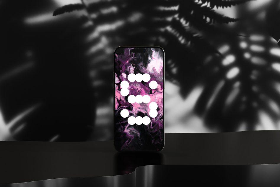 Smartphone mockup featuring a modern abstract digital art background with pink and black tones suitable for designers seeking unique graphic templates.