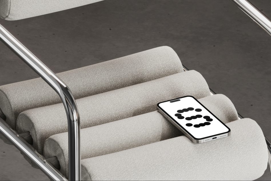 Mockup of a smartphone on a modern cushioned chair. Ideal for showcasing mobile app designs or UI templates. Keywords: mockup, smartphone, design.