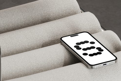 Minimal smartphone mockup on textured fabric background ideal for designers digital asset marketplace featuring sleek design and modern aesthetics.